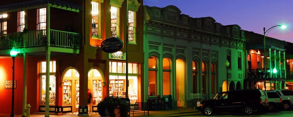 Square Books and the storefronts of the Oxford Square at dusk